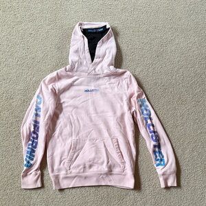 Hollister Men's Light Pink Hoodie with Blue Sleeve Logos